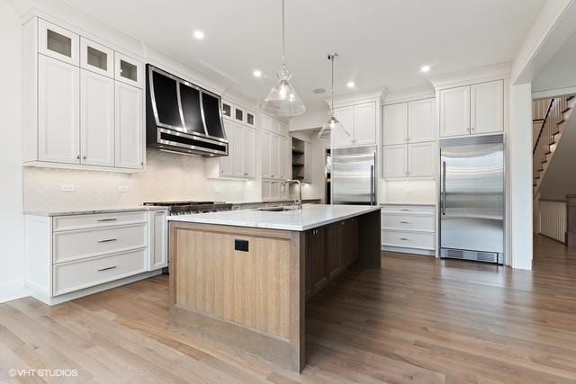 260 E Grantley Ave, Elmhurst, IL 60126 - kitchen with built in refrigerator, a sink, a kitchen island with sink, and wall chimney exhaust hood