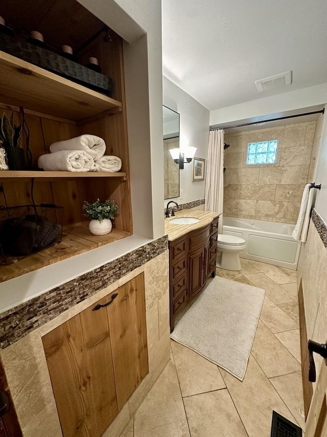 full bathroom with tile patterned floors, visible vents, toilet, and shower / bath combo