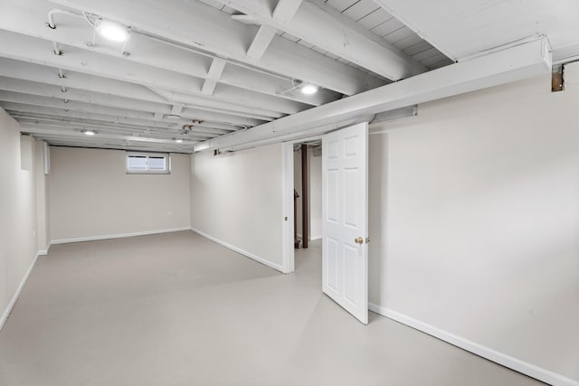basement featuring baseboards