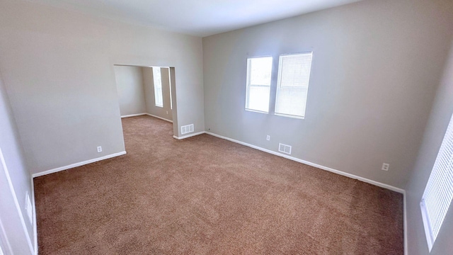 2830 Bernice Rd, Lansing, IL 60438 - spare room with baseboards, visible vents, and carpet floors