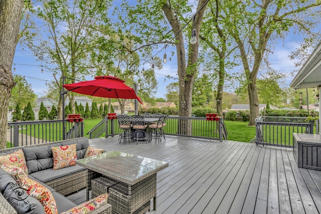wooden deck featuring an outdoor hangout area, outdoor dining area, and a yard