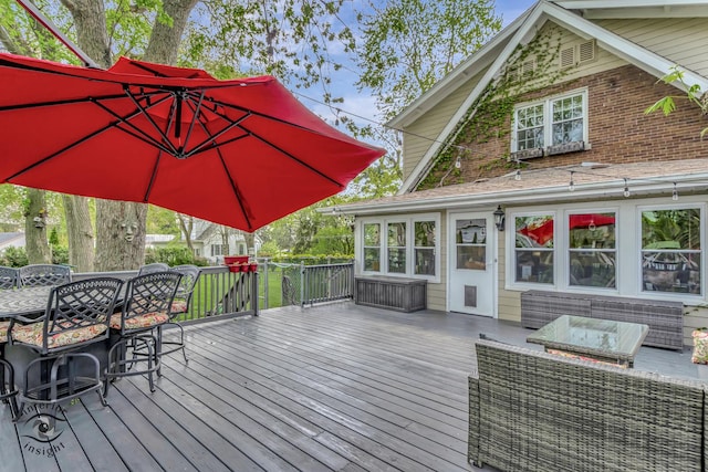 wooden deck with an outdoor hangout area