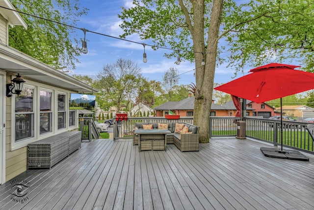 wooden deck with an outdoor living space and a residential view