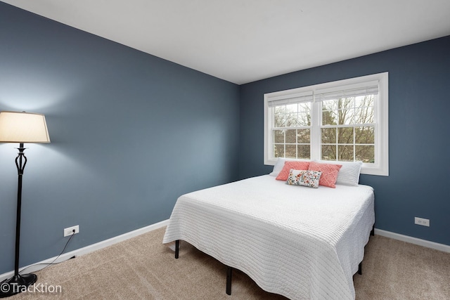 carpeted bedroom with baseboards