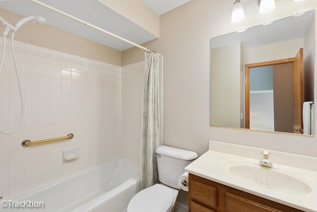 bathroom with shower / bathtub combination with curtain, vanity, and toilet