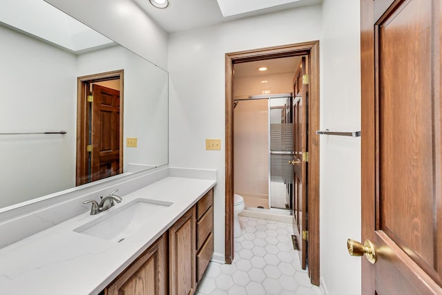 full bathroom with a shower stall, tile patterned floors, toilet, and vanity