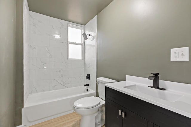 full bathroom featuring bathtub / shower combination, wood finished floors, toilet, and vanity