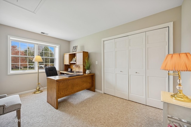 home office featuring baseboards, carpet flooring, and visible vents