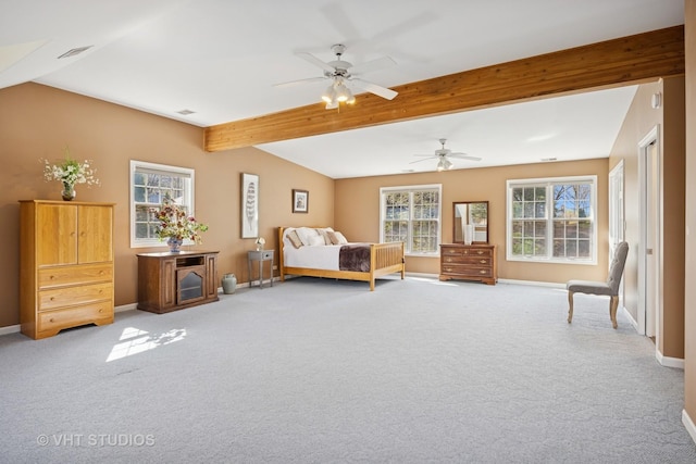 bedroom with baseboards, beam ceiling, and carpet
