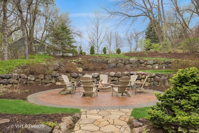 view of patio with a fire pit