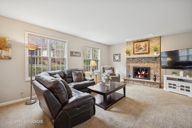 carpeted living area with baseboards and a fireplace