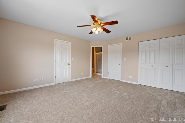 unfurnished bedroom featuring visible vents, ceiling fan, carpet floors, and baseboards