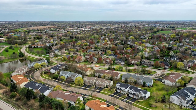 aerial view with a water view and a residential view