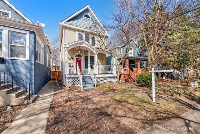 623 Oakton St, Evanston, IL 60202 - victorian house featuring covered porch and central AC unit