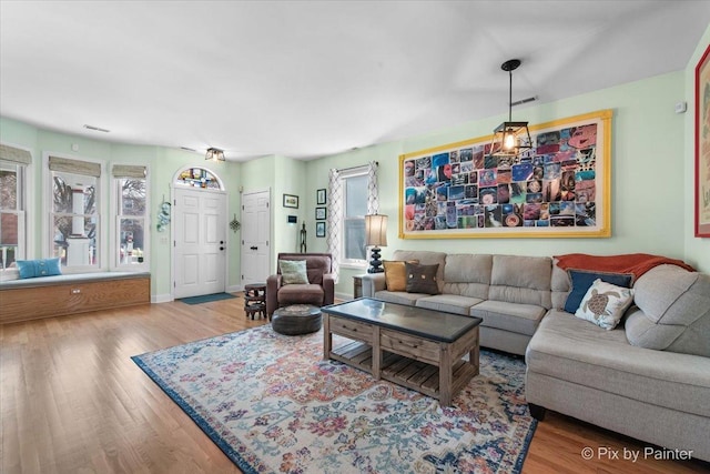 623 Oakton St, Evanston, IL 60202 - living room featuring visible vents, baseboards, and wood finished floors