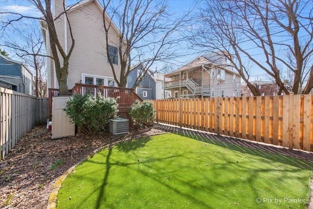 623 Oakton St, Evanston, IL 60202 - view of yard featuring a fenced backyard, central AC, and a deck