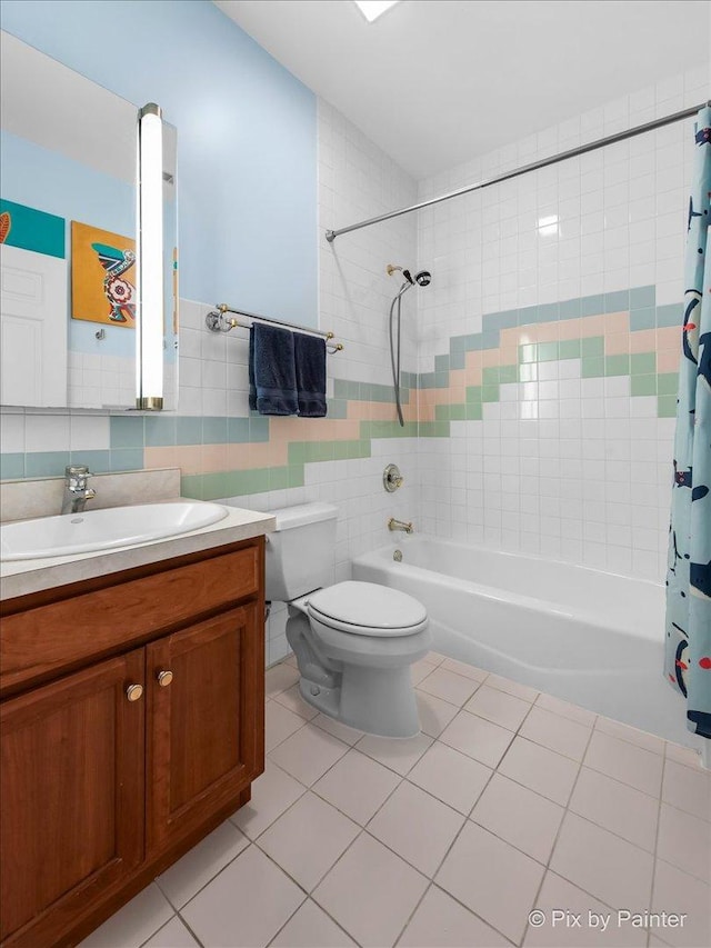 623 Oakton St, Evanston, IL 60202 - bathroom featuring toilet, vanity, shower / bathtub combination with curtain, tile patterned flooring, and tile walls