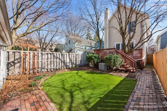 623 Oakton St, Evanston, IL 60202 - view of yard with a fenced backyard, central AC, and a deck