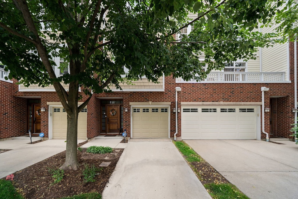 507 Grove Ln Unit H, Forest Park, IL 60130 - view of front of house featuring concrete driveway and brick siding