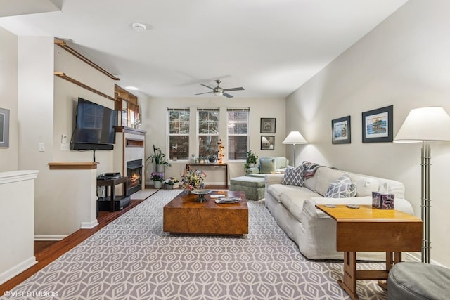 507 Grove Ln Unit H, Forest Park, IL 60130 - living area featuring baseboards, ceiling fan, wood finished floors, and a tile fireplace
