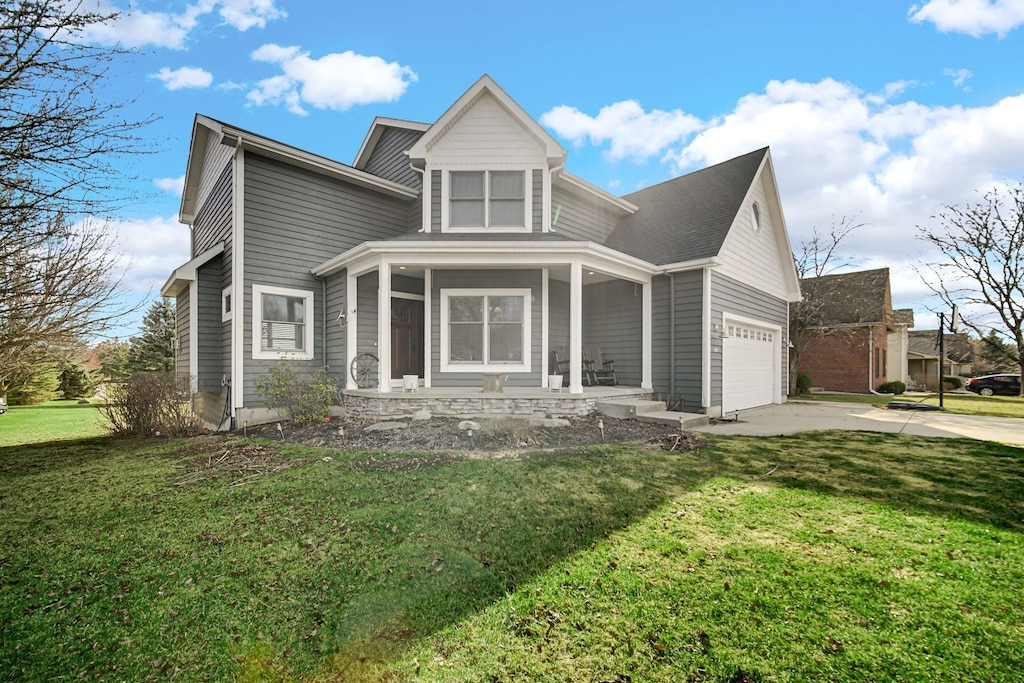 1251 Jade Blvd, Valparaiso, IN 46385 - view of front of home with covered porch, driveway, and a front lawn
