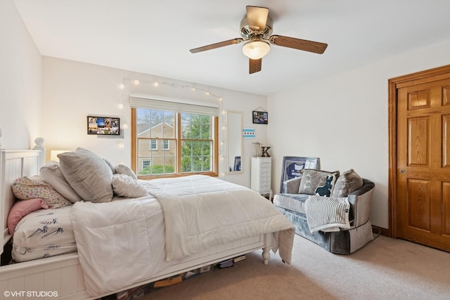carpeted bedroom with a ceiling fan