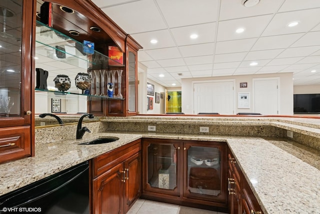 bar with bar area, recessed lighting, black dishwasher, and a sink