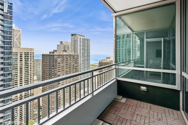 balcony with a city view and a water view