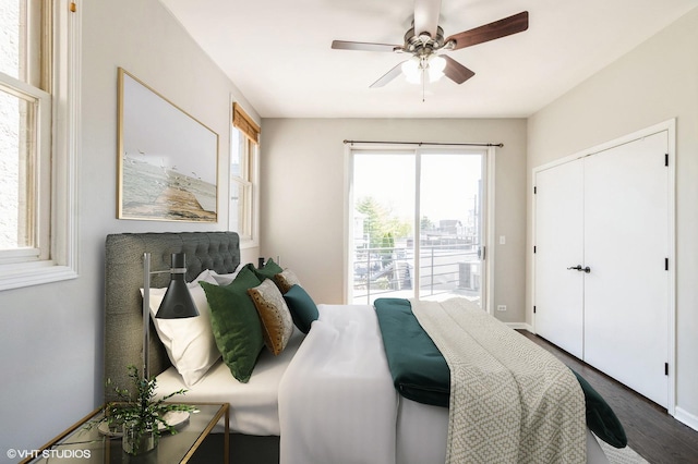 bedroom with dark wood-style floors, access to outside, ceiling fan, a closet, and baseboards