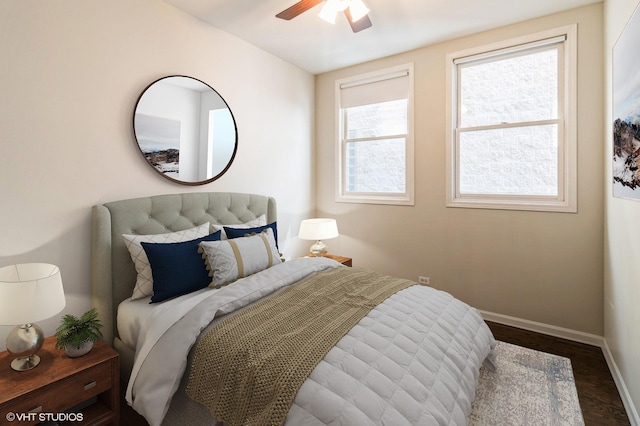 bedroom with baseboards, wood finished floors, and ceiling fan