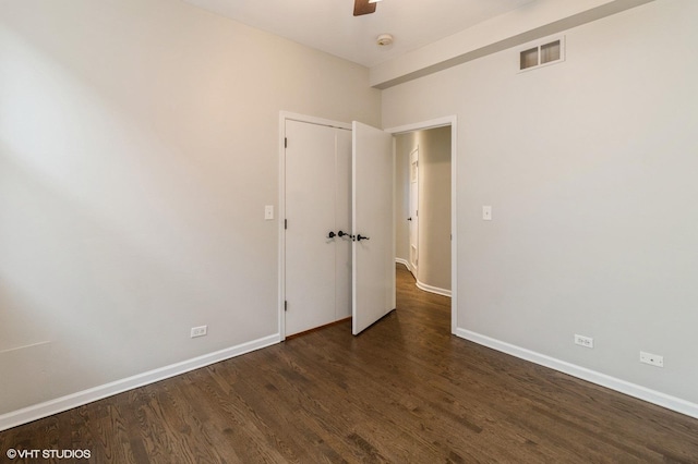 unfurnished room with wood finished floors, baseboards, a ceiling fan, and a smoke detector