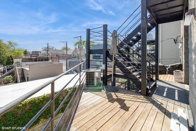 wooden terrace featuring stairway and central AC