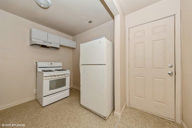 kitchen featuring visible vents, baseboards, under cabinet range hood, and white appliances