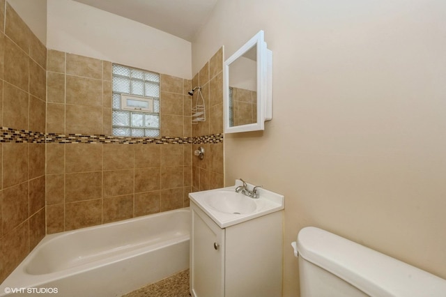 bathroom with toilet, vanity, and shower / bathtub combination