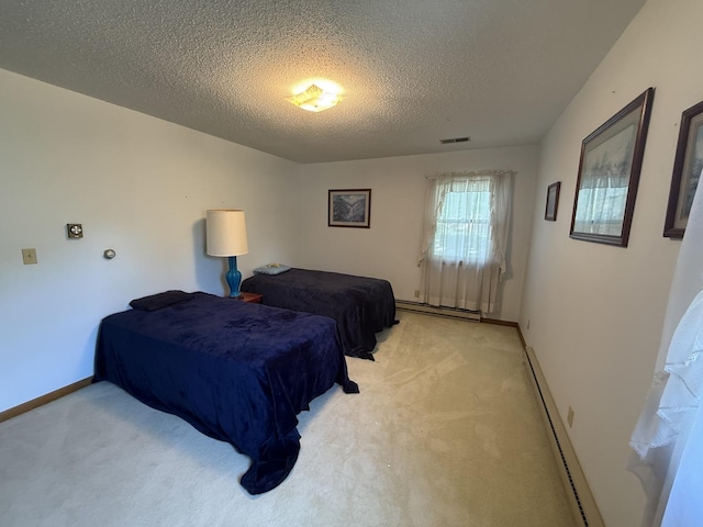 203 S Whitehead St, Tolono, IL 61880 - bedroom with a baseboard radiator, light colored carpet, a textured ceiling, and baseboard heating