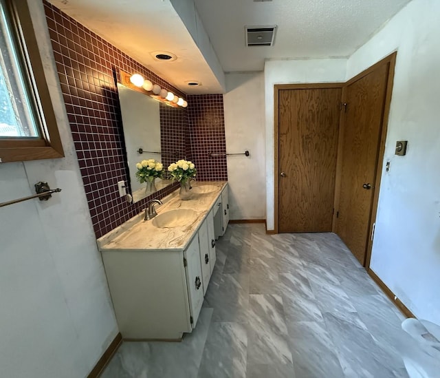 203 S Whitehead St, Tolono, IL 61880 - full bath with double vanity and baseboards