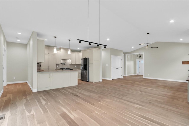 2816 Clarion Rd, Urbana, IL 61802 - kitchen with open floor plan, stainless steel refrigerator with ice dispenser, decorative backsplash, baseboards, and recessed lighting
