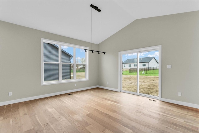 2816 Clarion Rd, Urbana, IL 61802 - unfurnished dining area featuring light wood-style flooring, vaulted ceiling, and baseboards