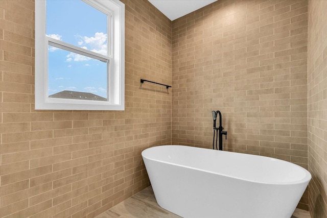 2816 Clarion Rd, Urbana, IL 61802 - bathroom with a freestanding tub and tile walls