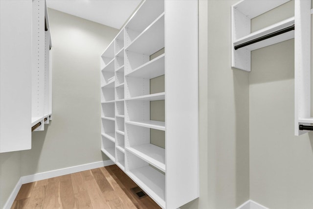 2816 Clarion Rd, Urbana, IL 61802 - walk in closet featuring wood finished floors