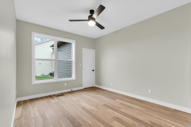 2816 Clarion Rd, Urbana, IL 61802 - unfurnished room featuring light wood-style flooring, baseboards, and ceiling fan