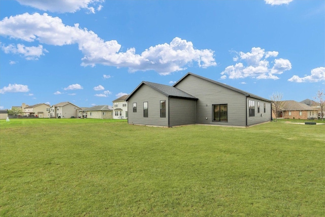 2816 Clarion Rd, Urbana, IL 61802 - rear view of house with a lawn and a residential view