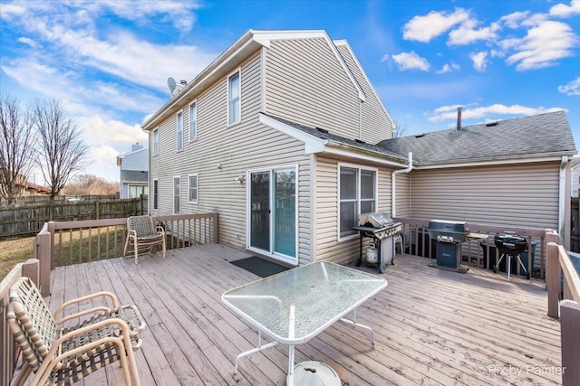 wooden deck featuring area for grilling and fence