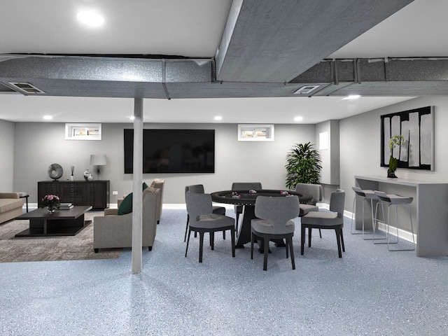 dining area featuring speckled floor, baseboards, and visible vents