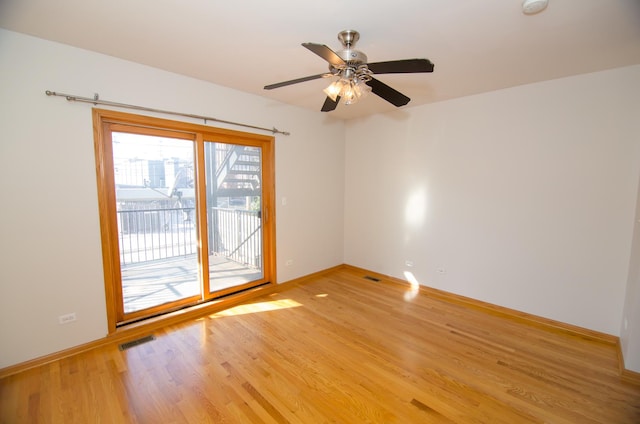 4312 S Saint Lawrence Ave Unit 1, Chicago, IL 60653 - unfurnished room with baseboards, ceiling fan, visible vents, and light wood-type flooring