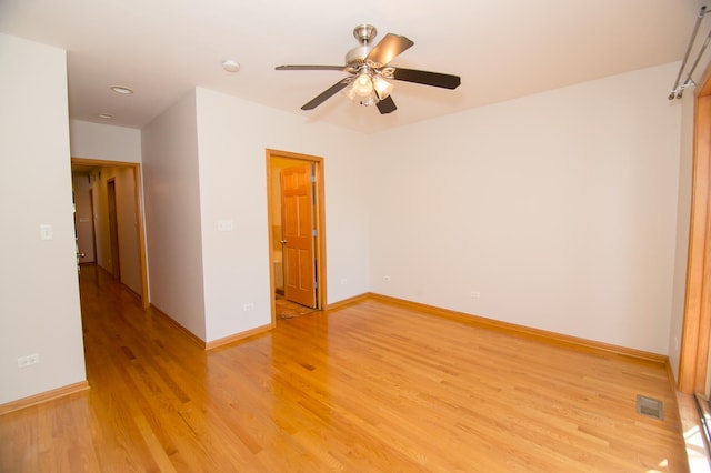 4312 S Saint Lawrence Ave Unit 1, Chicago, IL 60653 - empty room with light wood finished floors, baseboards, visible vents, and a ceiling fan