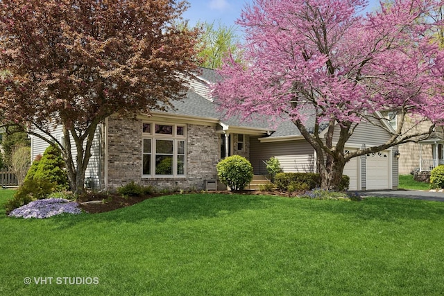 4230 Forest Glen Dr, Hoffman Estates, IL 60192 - view of front of home with roof with shingles, driveway, a front yard, a garage, and brick siding