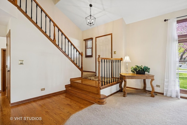 4230 Forest Glen Dr, Hoffman Estates, IL 60192 - entryway featuring plenty of natural light, baseboards, stairway, and a chandelier