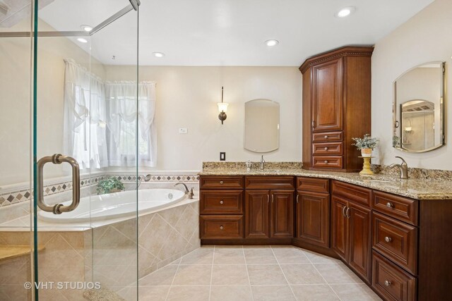 4230 Forest Glen Dr, Hoffman Estates, IL 60192 - full bathroom featuring a garden tub, tile patterned floors, a shower stall, double vanity, and recessed lighting