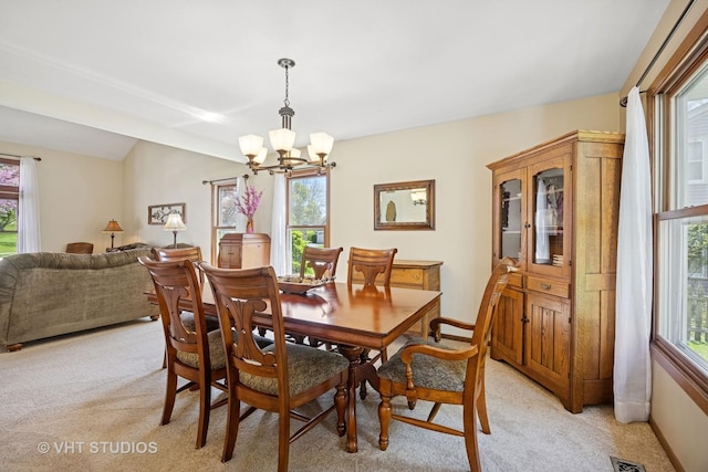 4230 Forest Glen Dr, Hoffman Estates, IL 60192 - dining room featuring light carpet, a chandelier, and plenty of natural light